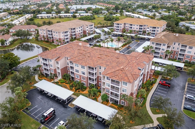 birds eye view of property featuring a water view