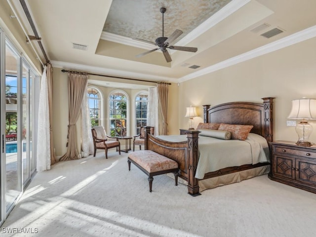 carpeted bedroom featuring access to exterior, ornamental molding, a raised ceiling, and ceiling fan