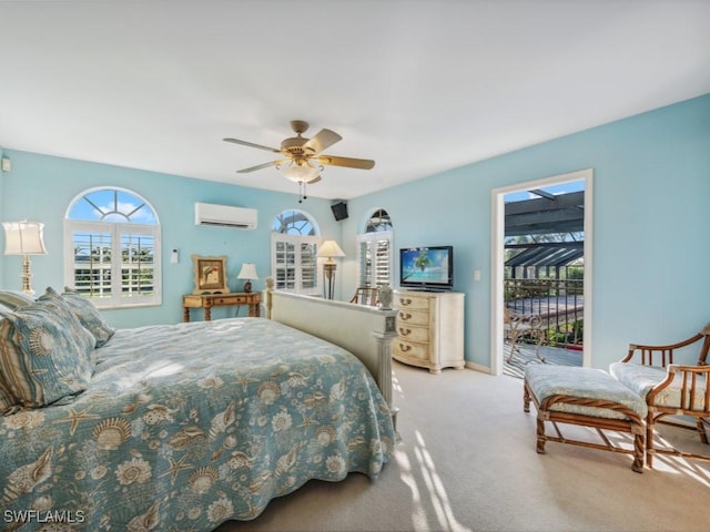 carpeted bedroom with ceiling fan, a wall mounted air conditioner, and access to exterior