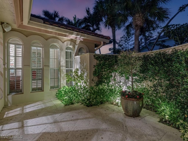 view of patio terrace at dusk