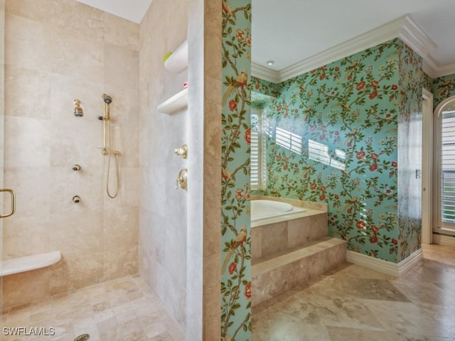 bathroom featuring ornamental molding and separate shower and tub