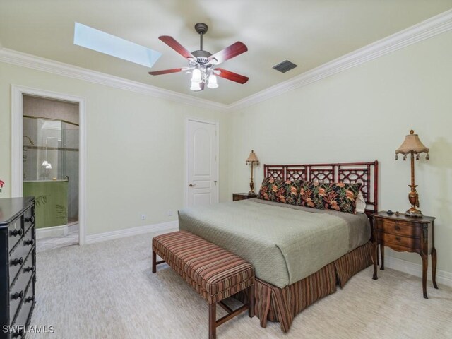 bedroom with crown molding, light colored carpet, a skylight, and ceiling fan