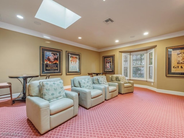 carpeted cinema room featuring ornamental molding and a skylight