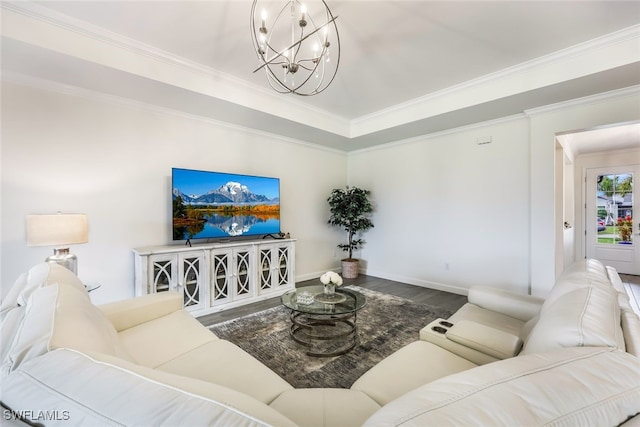 living room featuring hardwood / wood-style floors, a chandelier, and ornamental molding