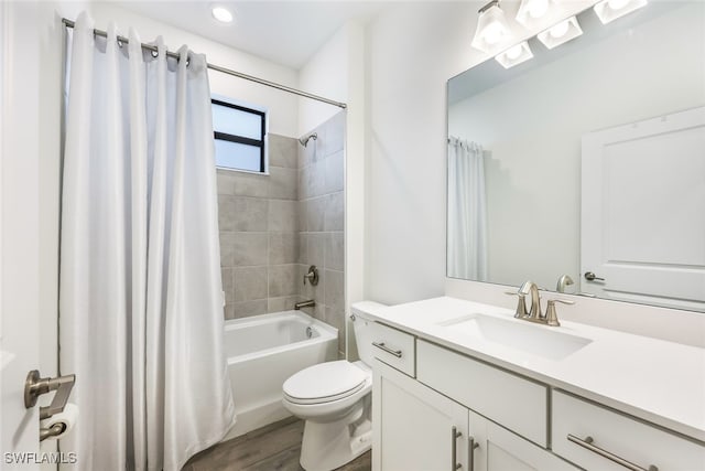 full bathroom with hardwood / wood-style floors, toilet, vanity, and shower / bathtub combination with curtain