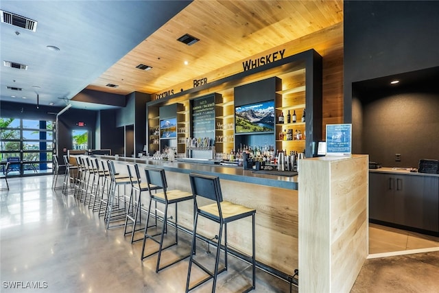 bar featuring wooden ceiling