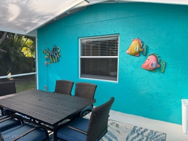 exterior space with outdoor dining space