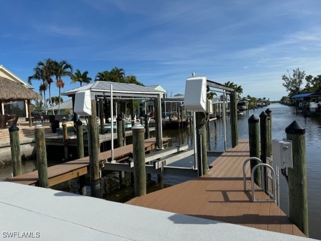 view of dock with a water view and boat lift