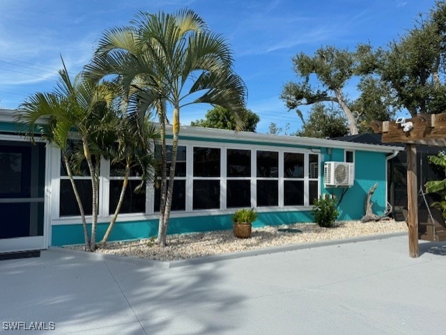 back of property featuring a sunroom