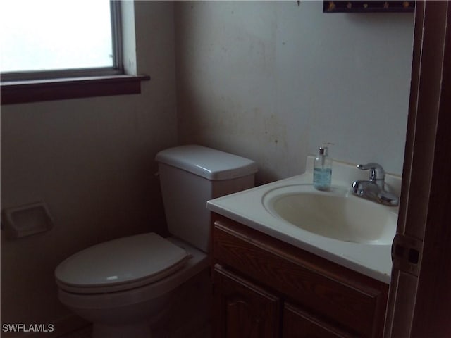 bathroom with vanity and toilet