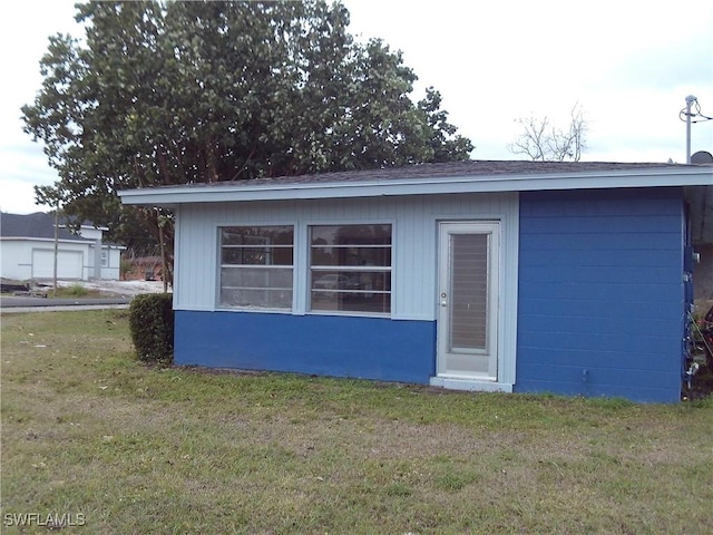 view of outdoor structure with a yard