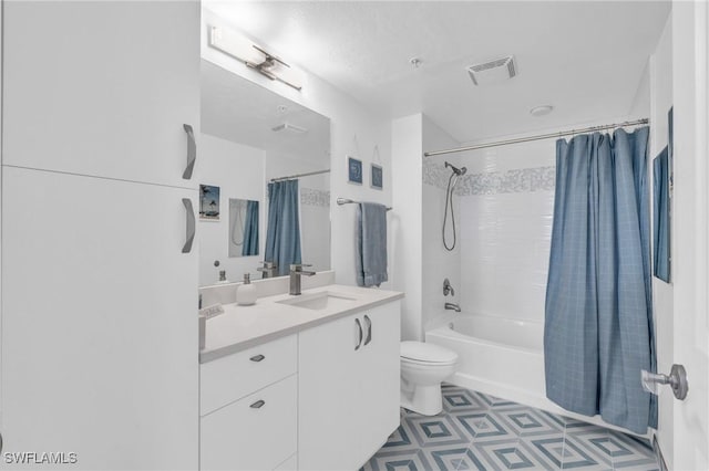 full bathroom with vanity, shower / tub combo, and toilet