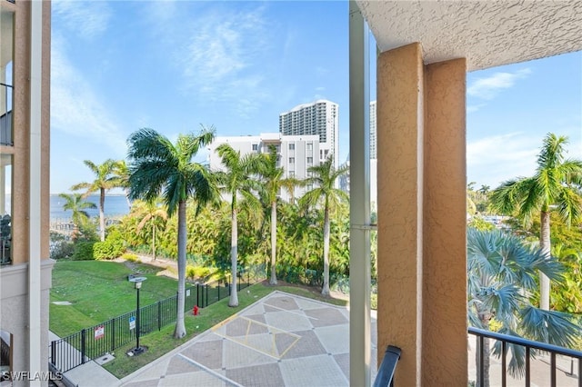 balcony featuring a water view