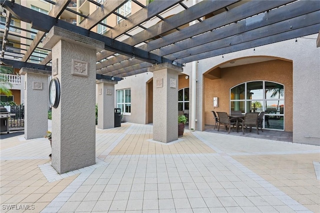 view of patio featuring a pergola