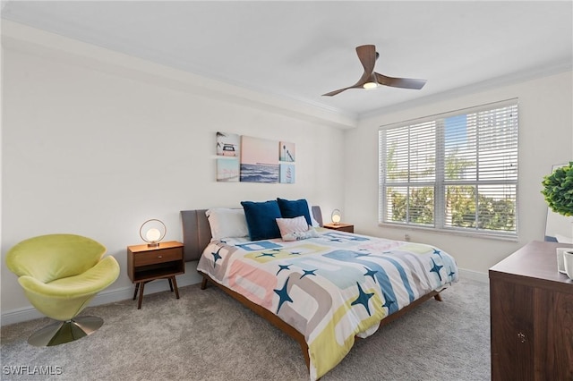 bedroom featuring light carpet, crown molding, and ceiling fan