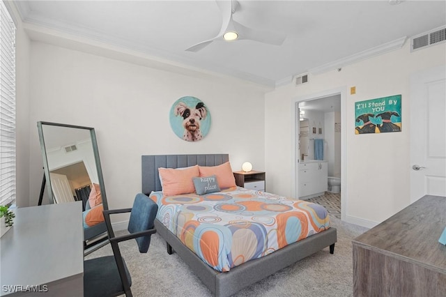 carpeted bedroom with connected bathroom, ornamental molding, and ceiling fan