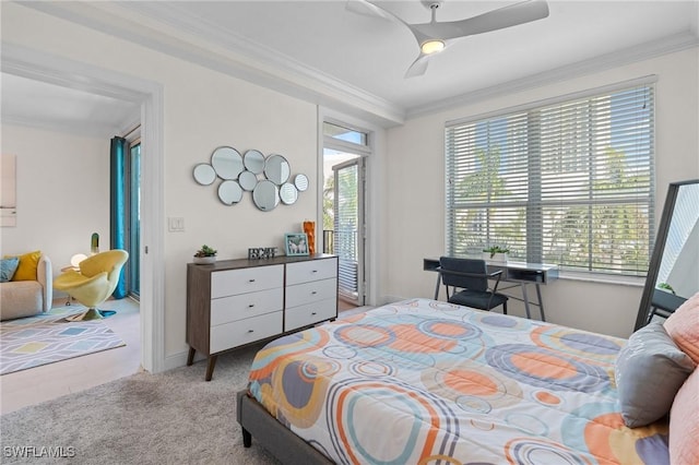 carpeted bedroom with ceiling fan and ornamental molding