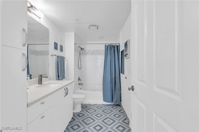 full bathroom featuring vanity, shower / tub combo, and toilet