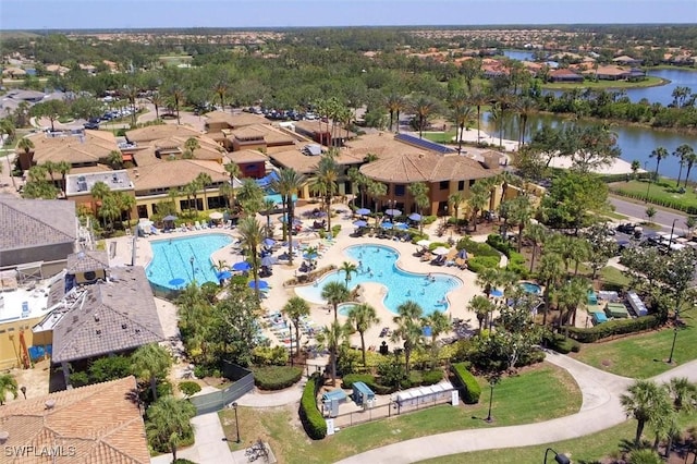 birds eye view of property with a water view