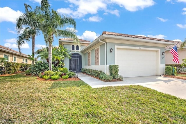 view of front of home with a garage and a front lawn