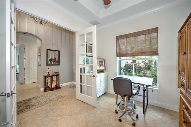 office space with french doors, a raised ceiling, ceiling fan, light tile patterned floors, and crown molding