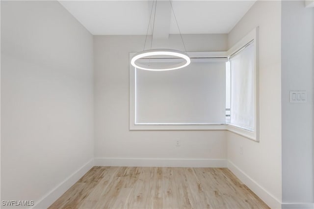 spare room featuring light hardwood / wood-style floors