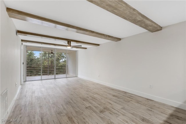 unfurnished room featuring ceiling fan, light hardwood / wood-style floors, and beamed ceiling