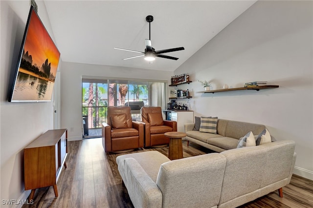 living room featuring lofted ceiling, hardwood / wood-style floors, ceiling fan, and indoor bar