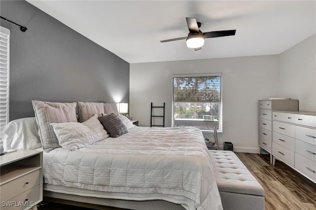 bedroom with dark wood-type flooring and ceiling fan