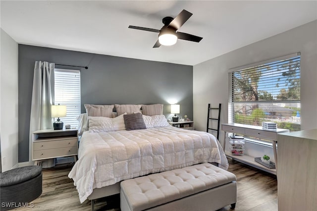 bedroom featuring hardwood / wood-style flooring and ceiling fan