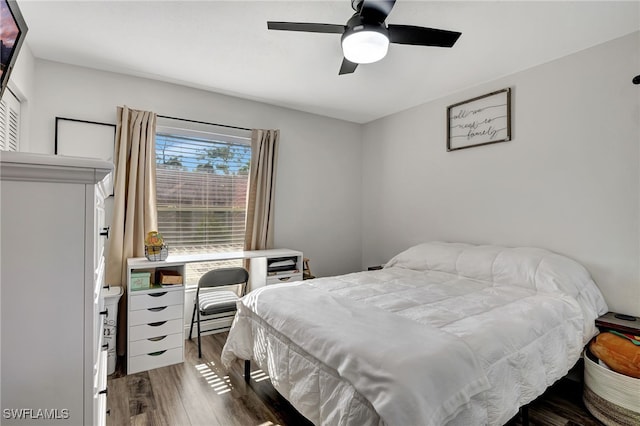 bedroom featuring hardwood / wood-style flooring and ceiling fan