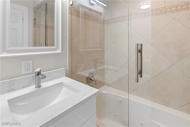 bathroom featuring a combined bath / shower with jetted tub and vanity