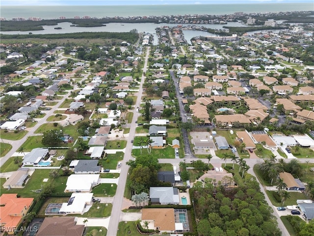 birds eye view of property featuring a water view and a residential view