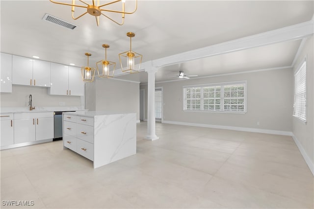 kitchen featuring a sink, visible vents, white cabinets, dishwasher, and decorative columns