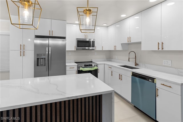 kitchen with white cabinets, decorative light fixtures, stainless steel appliances, a sink, and recessed lighting