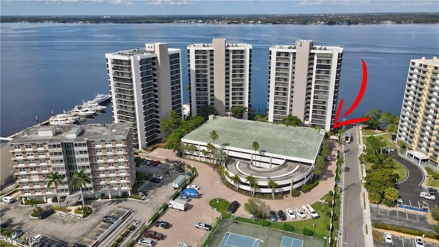 birds eye view of property with a water view