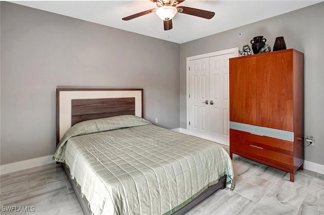 bedroom featuring ceiling fan and a closet