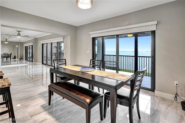 dining space with a water view