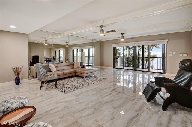 living room with ceiling fan, ornamental molding, and a wealth of natural light