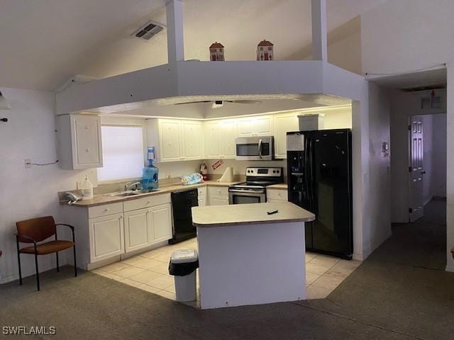 kitchen with light tile patterned floors, white cabinets, and black appliances