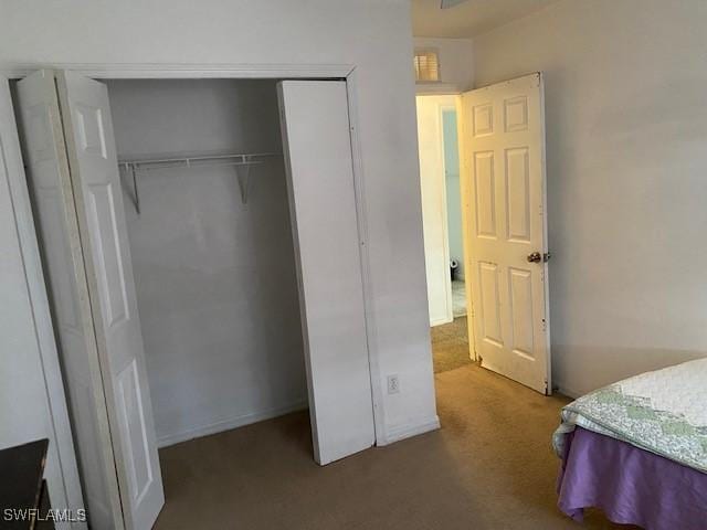 bedroom featuring a closet and carpet flooring