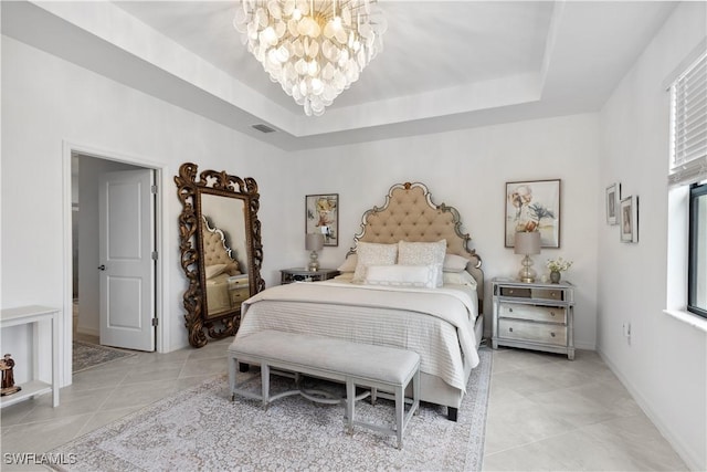 tiled bedroom featuring a raised ceiling and a notable chandelier