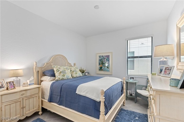 bedroom featuring dark tile patterned floors