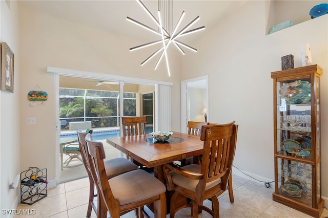 tiled dining space featuring a notable chandelier