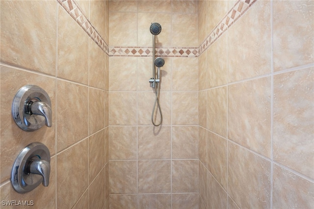 interior details with a tile shower