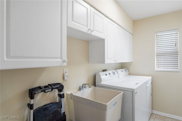 laundry area featuring cabinets, sink, independent washer and dryer, and light tile patterned floors