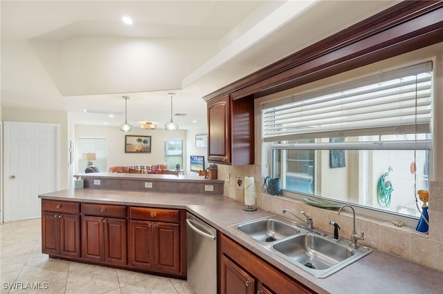 kitchen with tasteful backsplash, dishwasher, sink, hanging light fixtures, and light tile patterned floors