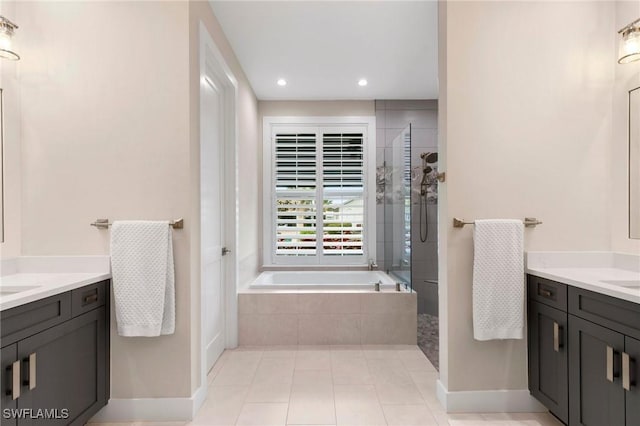 bathroom with tile patterned floors, vanity, and plus walk in shower