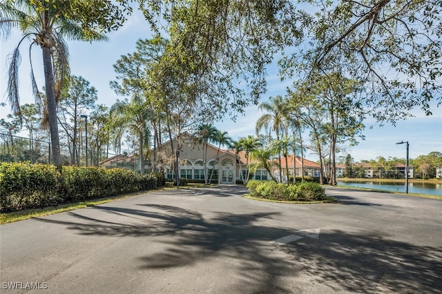 view of front of house with a water view