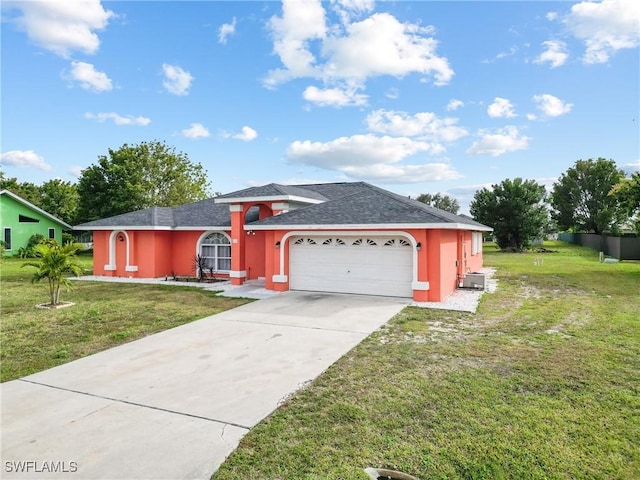 view of front facade featuring a garage and a front lawn